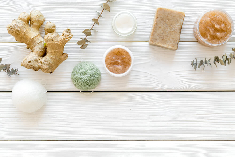 Ginger root on table with other bath ingredients